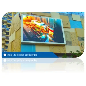 Large full-color outdoor LED display mounted on a building in India.