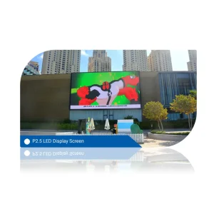 P2.5 LED display screen featuring colorful animated graphics in an urban setting.