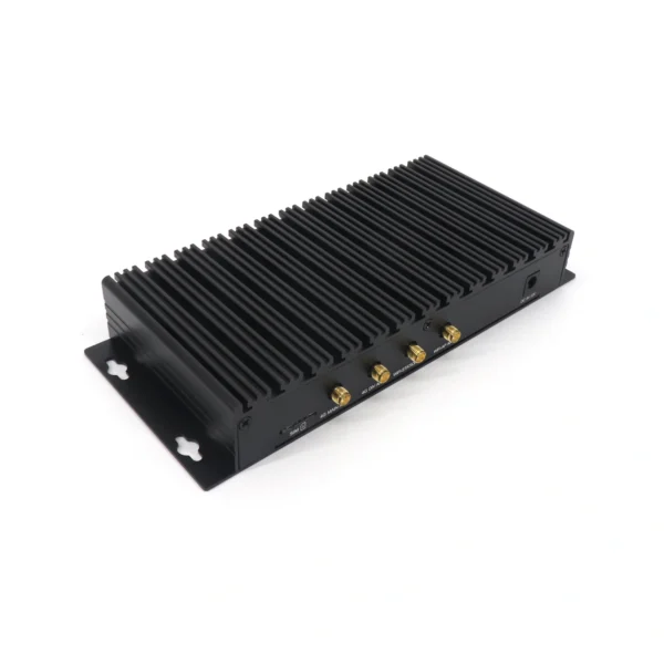 Black industrial-grade computing device with multiple ports and a ribbed exterior for heat dissipation.