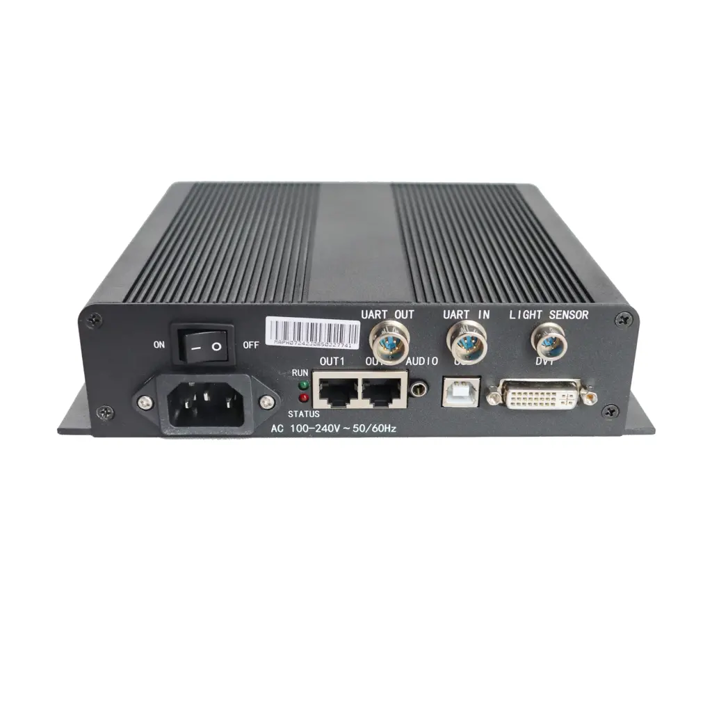 Black electronic device featuring various ports including UART, audio, and DVI connections on the back panel.