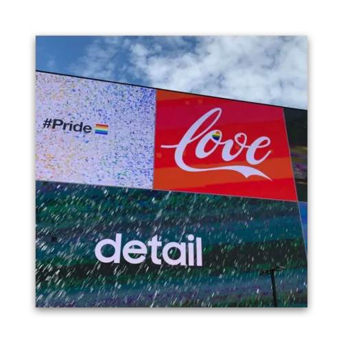 Mural featuring the words 'Love' and 'Detail' along with a rainbow pride flag symbol.