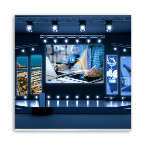 A digital presentation setup featuring multiple screens displaying data and graphics in a conference setting.